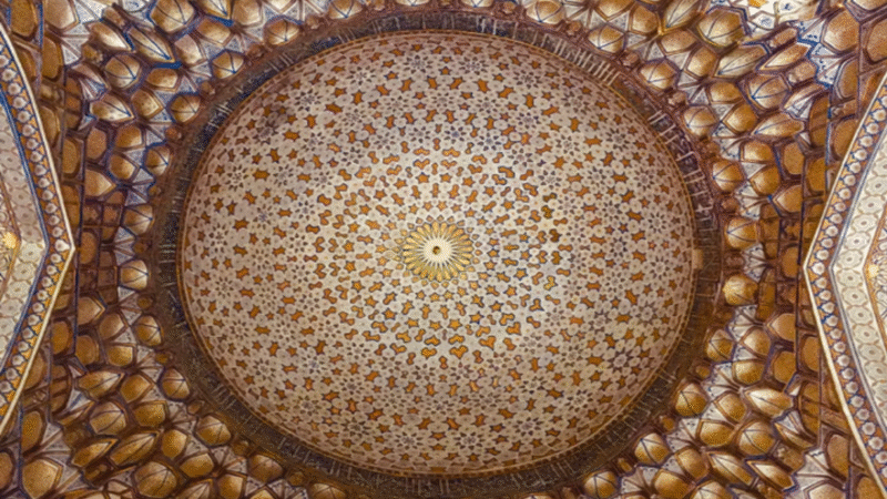 Intricate Islamic geometric patterns on the Tilya-Kori Madrasah ceiling in Samarkand